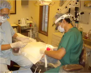 Periodontist Dr. Robert Alvarenga in surgery with patient in West Lebanon NH